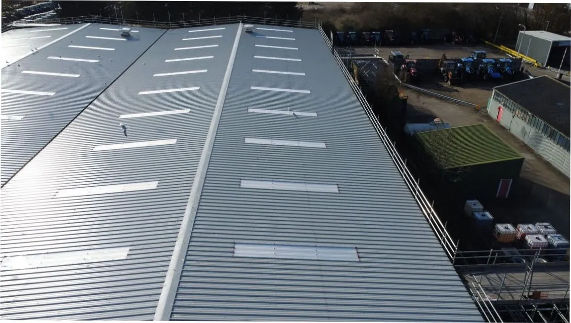 Aerial view of a large industrial warehouse roof refurbishment (illustrative)