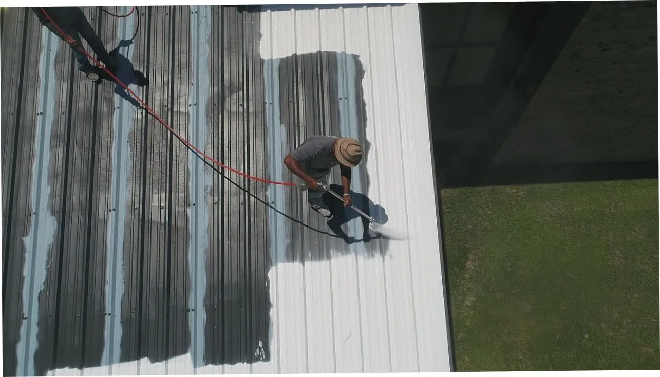 Industrial cladding spraying and refurbishment on a large retail warehouse (illustrative)