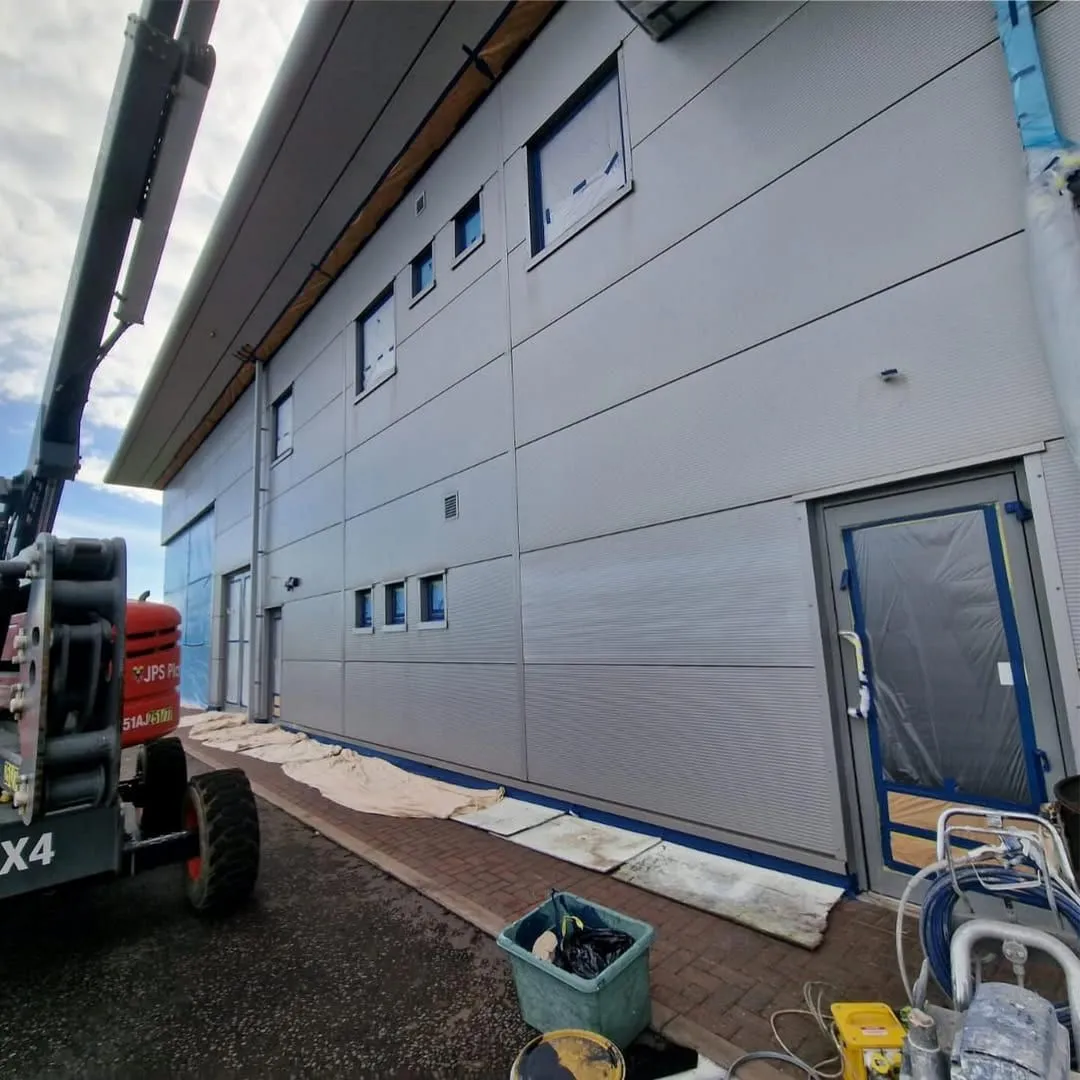 Industrial wall cladding installation (illustrative)